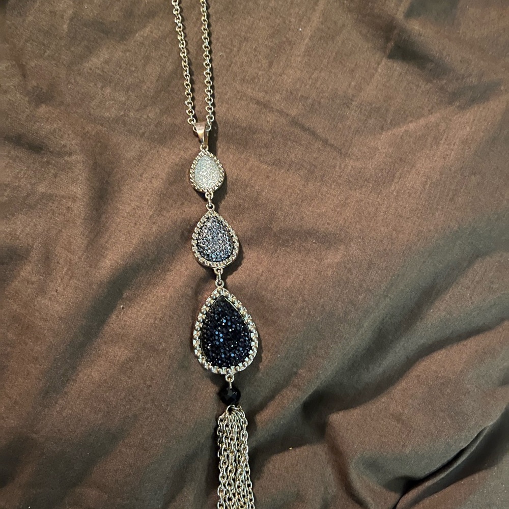 Gold necklace with rhinestones.